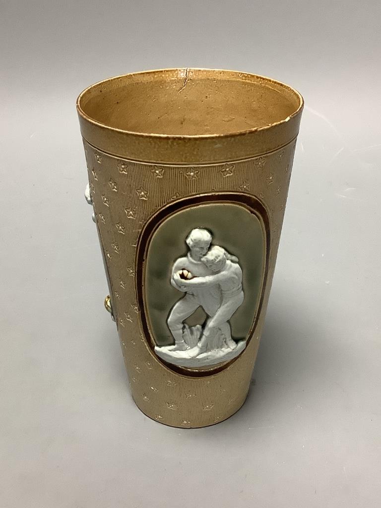 A Doulton Lambeth ‘Football & Rugby’ cup, dated 1891, height 14cm